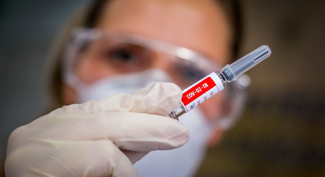 A nurse holds a COVID-19 vaccine candidate produced by Chinese company Sinovac Biotech at the São Lucas Hospital in Porto Alegre, Brazil, on Aug. 8. Silvio Avila/AFP via Getty Images