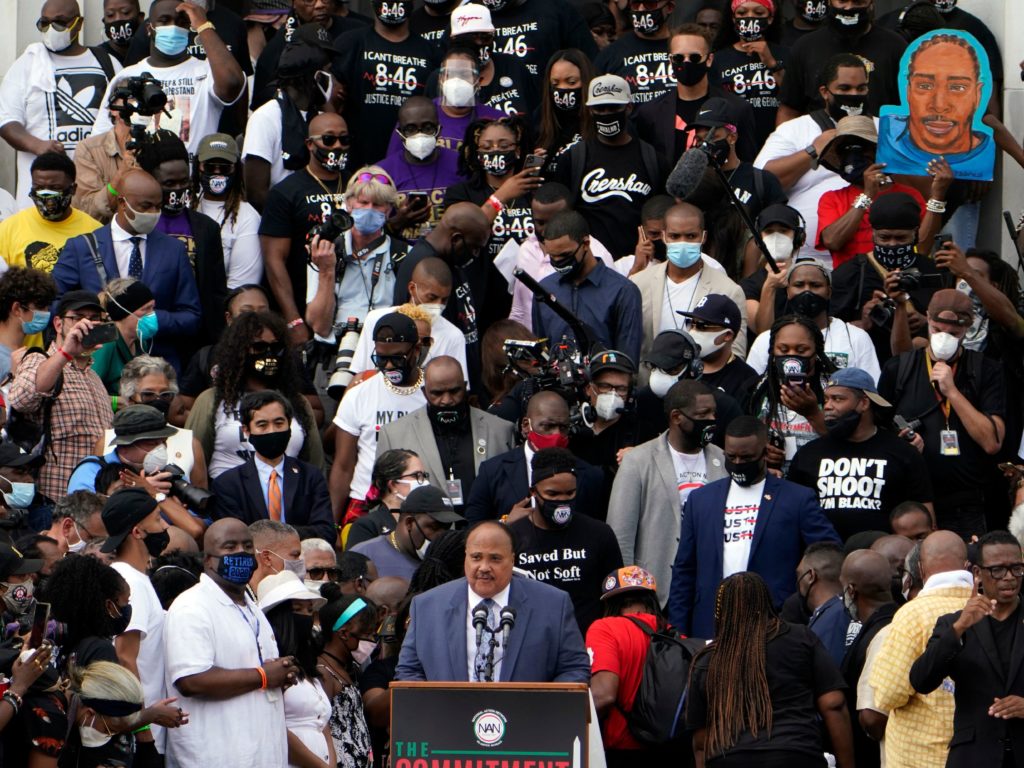 Human Rights Advocate Martin Luther King III, center at bottom, speaks at the Lincoln Memorial during the "Commitment March: Get Your Knee Off Our Necks" in Washington, D.C. CREDIT: Jacquelyn Martin/POOL/AFP via Getty Images