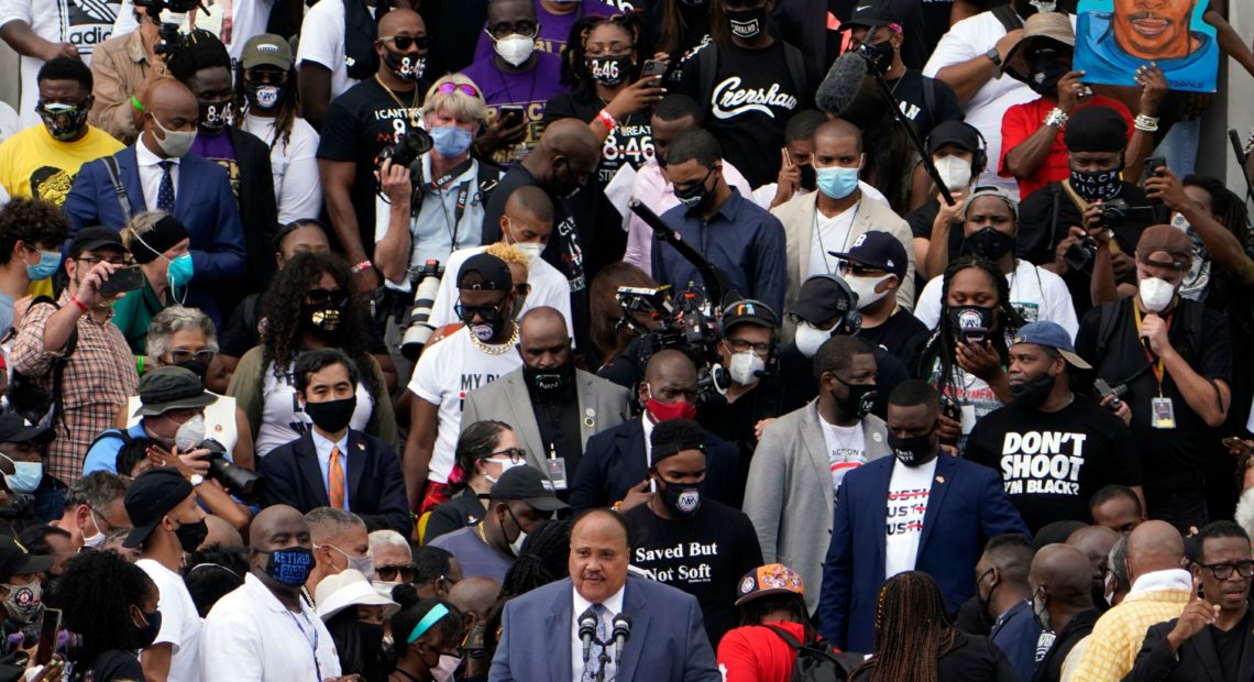 Human Rights Advocate Martin Luther King III, center at bottom, speaks at the Lincoln Memorial during the "Commitment March: Get Your Knee Off Our Necks" in Washington, D.C. CREDIT: Jacquelyn Martin/POOL/AFP via Getty Images