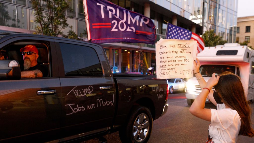 President Trump has threatened to intervene in what he calls a "mess" in Portland, Ore., after clashes between Trump supporters and Black Lives Matter demonstrators left one man dead over the weekend. CREDIT: John Rudoff/Anadolu Agency via Getty Images