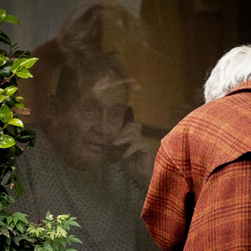 Dorothy Campbell talks to her husband, Gene Campbell, on the phone through his window at the Life Care Center of Kirkland on March 5, 2020, in Kirkland. CREDIT: Megan Farmer/KUOW