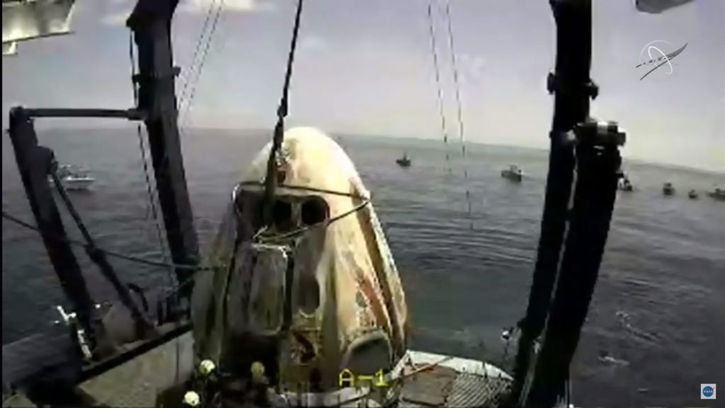 The SpaceX capsule sits aboard a recovery ship in the Gulf of Mexico. CREDIT: NASA/Screenshot by NPR