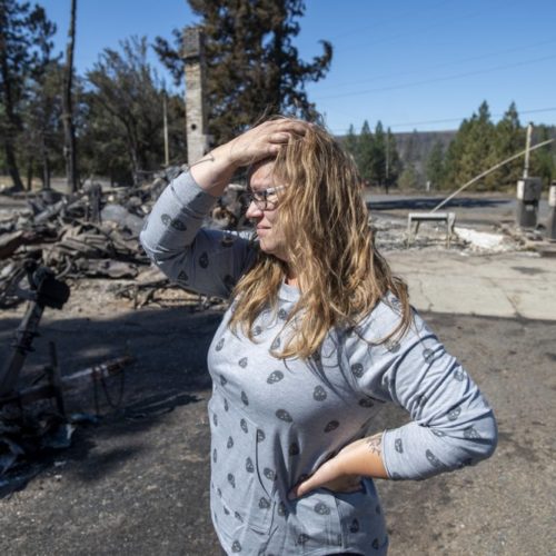 Hollie Jordan surveys her father's service station that was destroyed by a wildfire on Tuesday, Sept. 8, 2020, in Malden, Wash. "This was filled with work and life and memories and it's all gone," Jordan said. CREDIT: Jed Conklin/AP