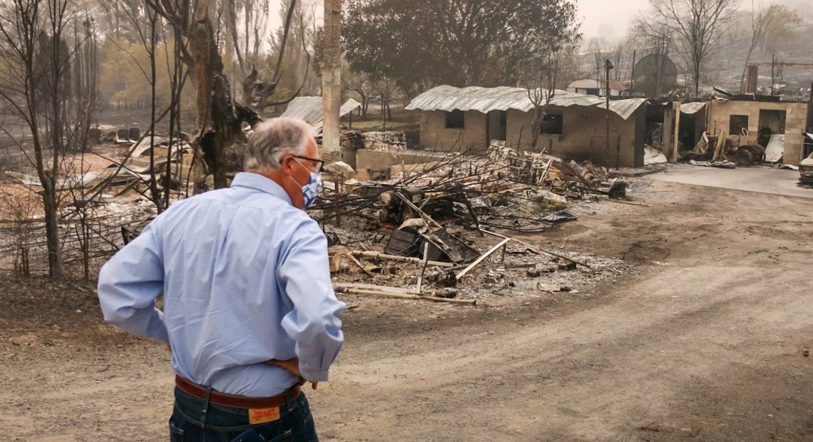 Washington Gov. Jay Inslee toured the town of Bridgeport on Saturday, Sept. 12, unknowingly bringing banned apples with him. But he didn't see the fire-evacuated farmworkers in Brewster, across the river, as the shelter was shut down by the time he arrived. CREDIT: Governor's Office/Twitter