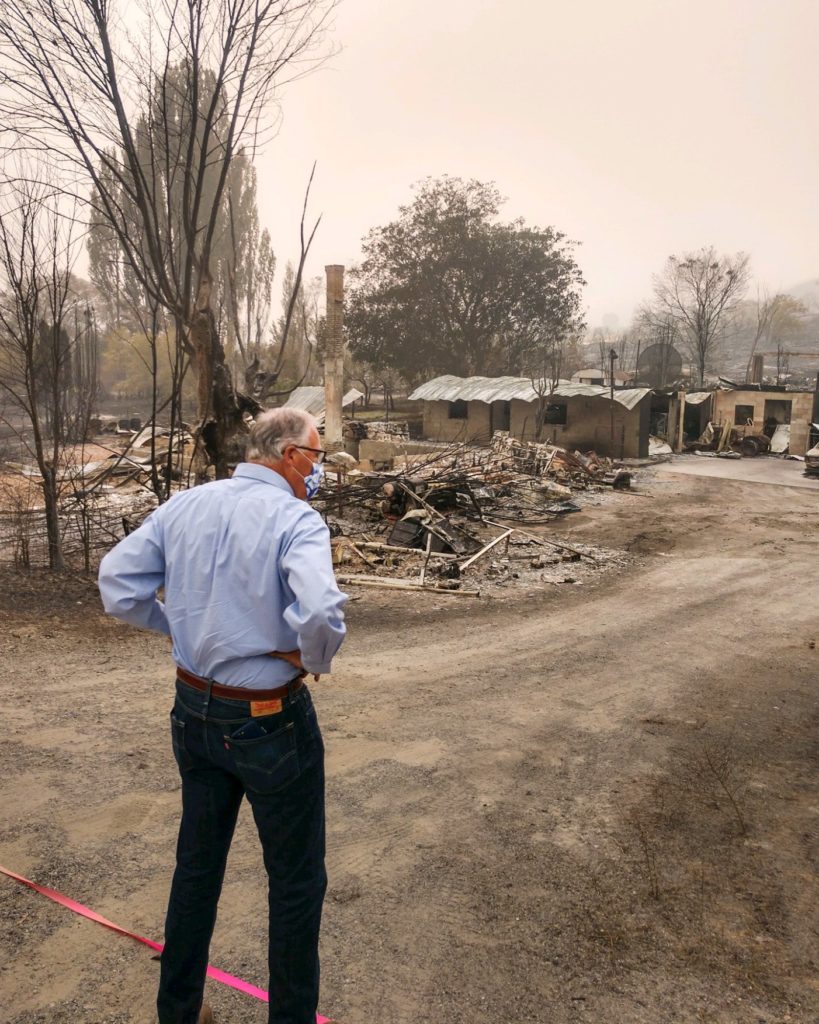 Washington Gov. Jay Inslee toured the town of Bridgeport on Saturday, Sept. 12, unknowingly bringing banned apples with him. But he didn't see the fire-evacuated farmworkers in Brewster, across the river, as the shelter was shut down by the time he arrived. CREDIT: Governor's Office/Twitter