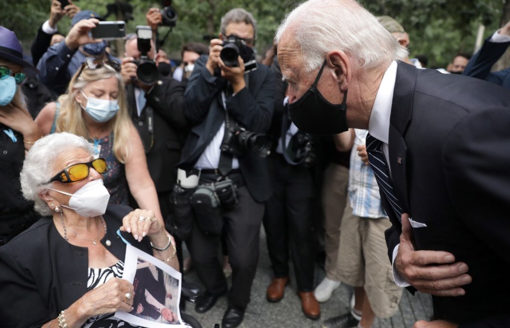 Democratic presidential candidate Joe Biden greets Maria Fisher, 90, whose son Andrew Fisher was killed in the World Trade Center's north tower 19 years ago. Amr Alfiky/Pool/AFP via Getty Images
