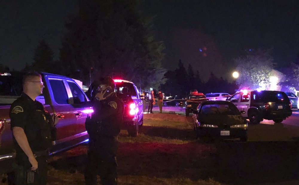 Police officials work at a scene where Michael Reinoehl, suspected of fatally shooting a supporter of a right-wing group in Portland, Oregon, last week was killed as investigators moved in to arrest him in Lacey, Wash., on Sept. 3, 2020. CREDIT: Ted Warren/AP