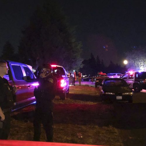 Police officials work at a scene where Michael Reinoehl, suspected of fatally shooting a supporter of a right-wing group in Portland, Oregon, last week was killed as investigators moved in to arrest him in Lacey, Wash., on Sept. 3, 2020. CREDIT: Ted Warren/AP