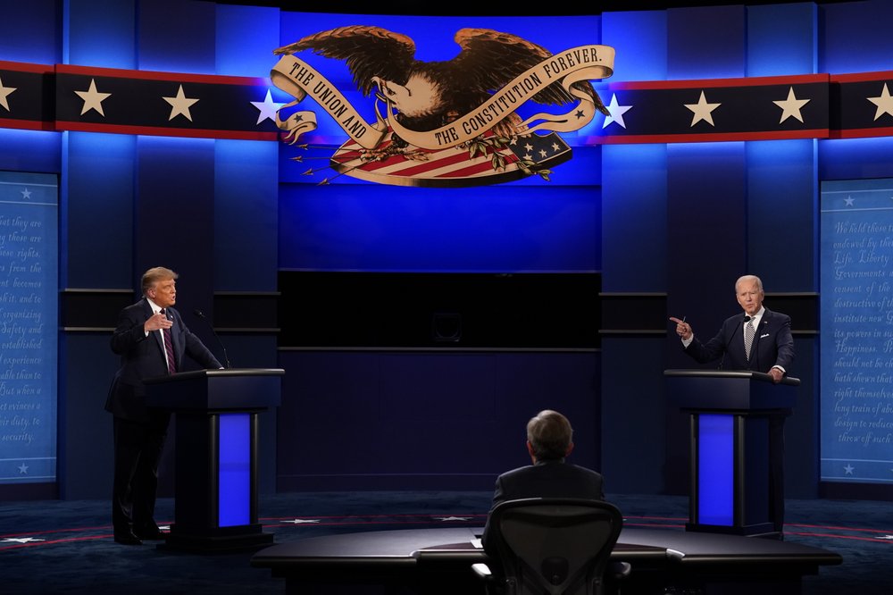 President Donald Trump and Democratic presidential candidate former Vice President Joe Biden with moderator Chris Wallace of Fox News during the first presidential debate Sept. 29, 2020, at Case Western University and Cleveland Clinic, in Cleveland, Ohio. CREDIT:Patrick Semansky/AP