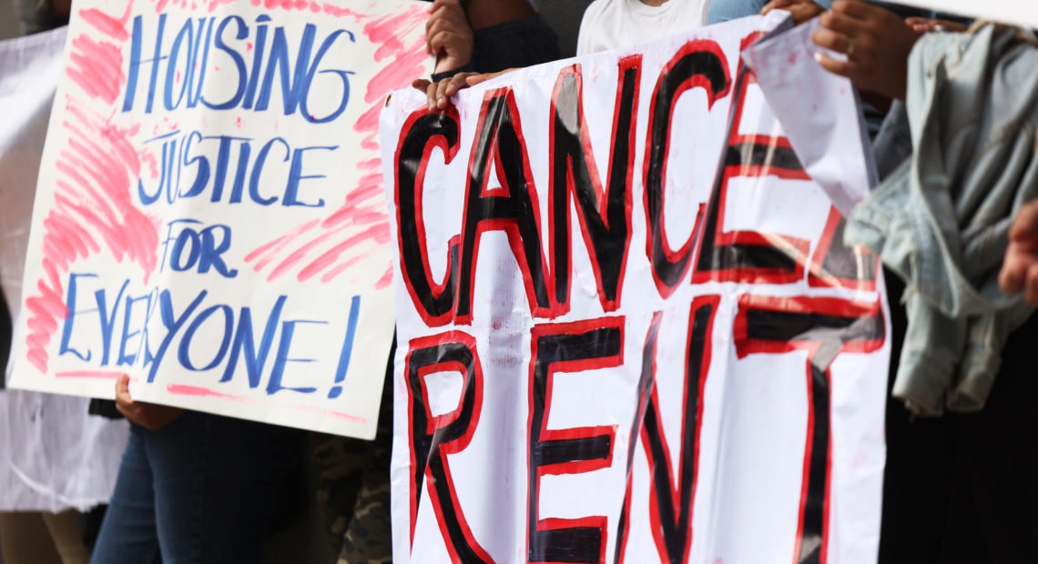 Demonstrators hold up signs as they gather at Brooklyn Housing court during a 'No Evictions, No Police' national day of action in New York City. CREDIT: Michael M. Santiago/Getty Images