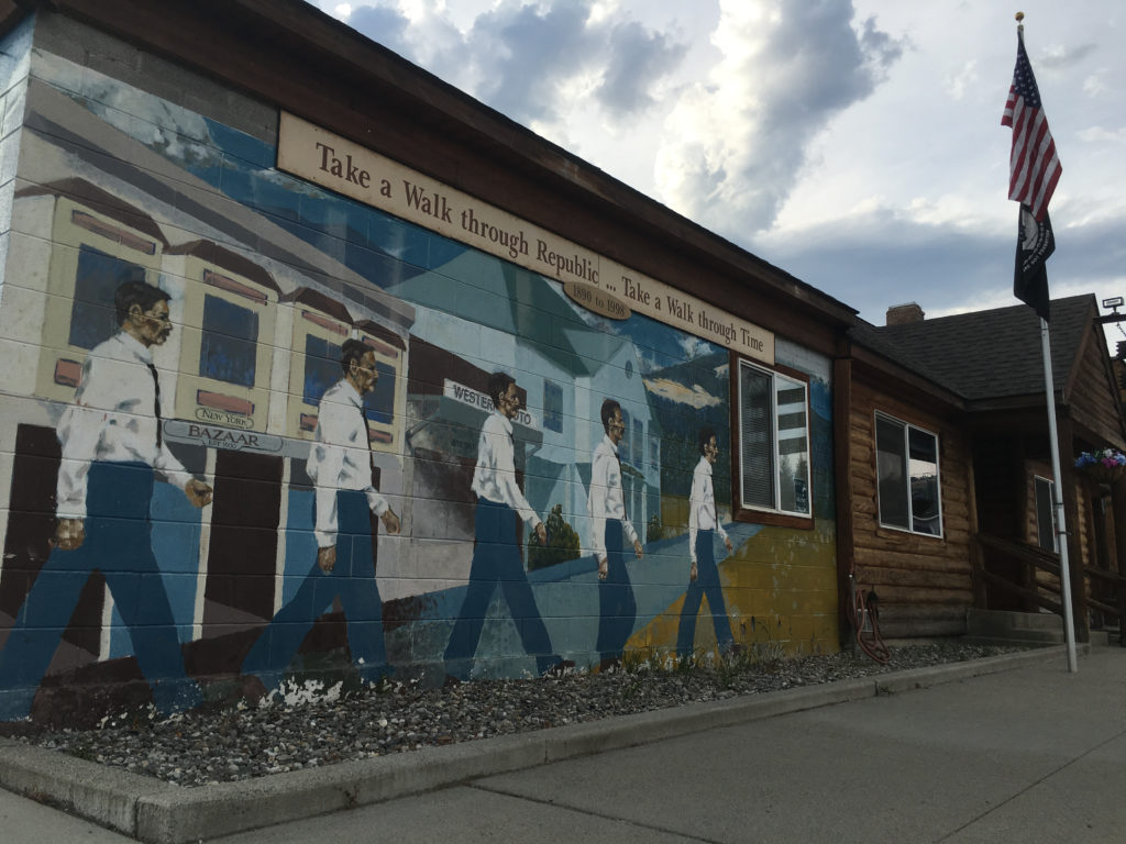 A mural on city hall in Republic, Washington. Much of the economy in the town and Ferry County has historically been tied to mining and timber, which have seen steep declines in recent decades.