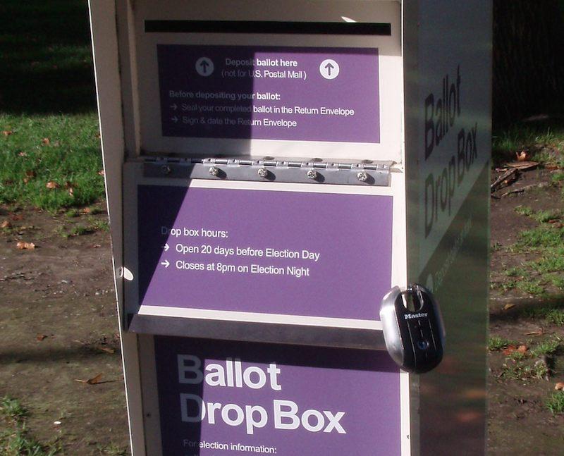 Washington election officials say they will work closely with the U.S. Postal Service to ensure ballots are delivered on time, but they're urging voters to use ballot drop boxes, especially closer to Election Day.