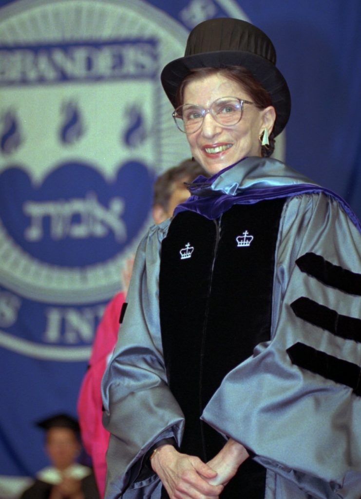 Ginsburg acknowledges applause at the 45th commencement at Brandeis University, where she received an honorary law degree in May 1996