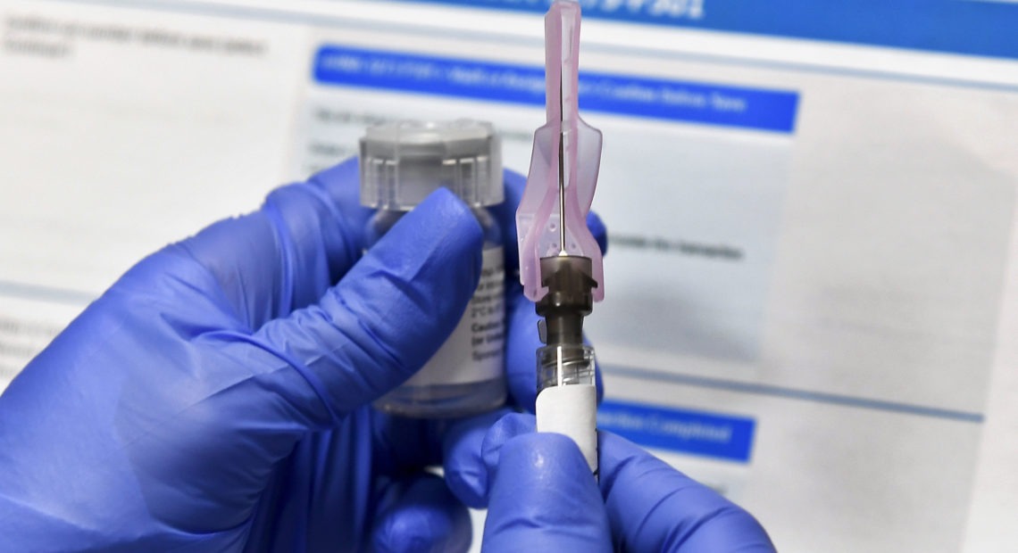 With development and testing underway, health officials are asking states to prepare for limited distribution of a potential vaccine as soon as this fall — though some experts say that's too early. CREDIT: Hans Pennink/AP
