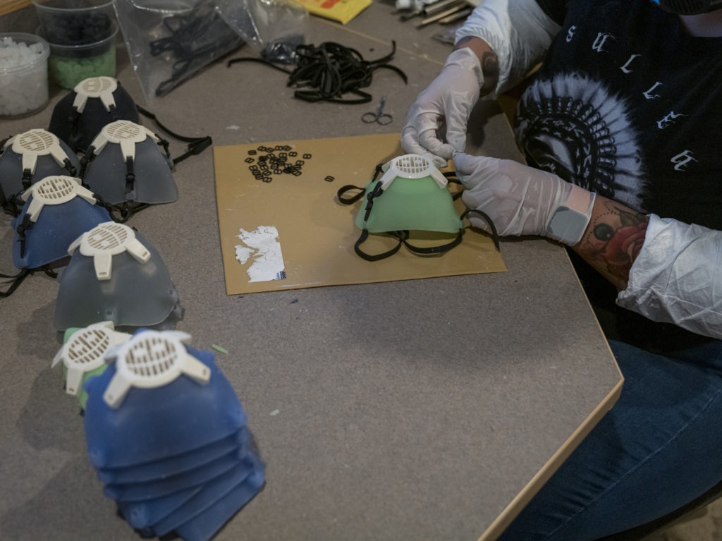 Earlier this year, Monster City Studios, a company that normally makes amusement park and movie props, pivoted to manufacturing MCS face shields with forehead protection. It was one of many small companies to make the switch. CREDIT: David Paul Morris/Bloomberg via Getty Images