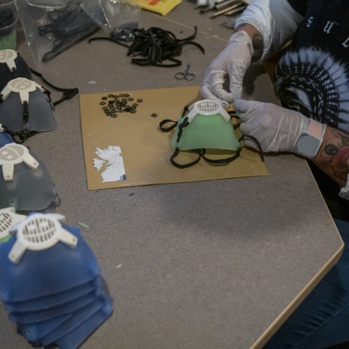 Earlier this year, Monster City Studios, a company that normally makes amusement park and movie props, pivoted to manufacturing MCS face shields with forehead protection. It was one of many small companies to make the switch. CREDIT: David Paul Morris/Bloomberg via Getty Images