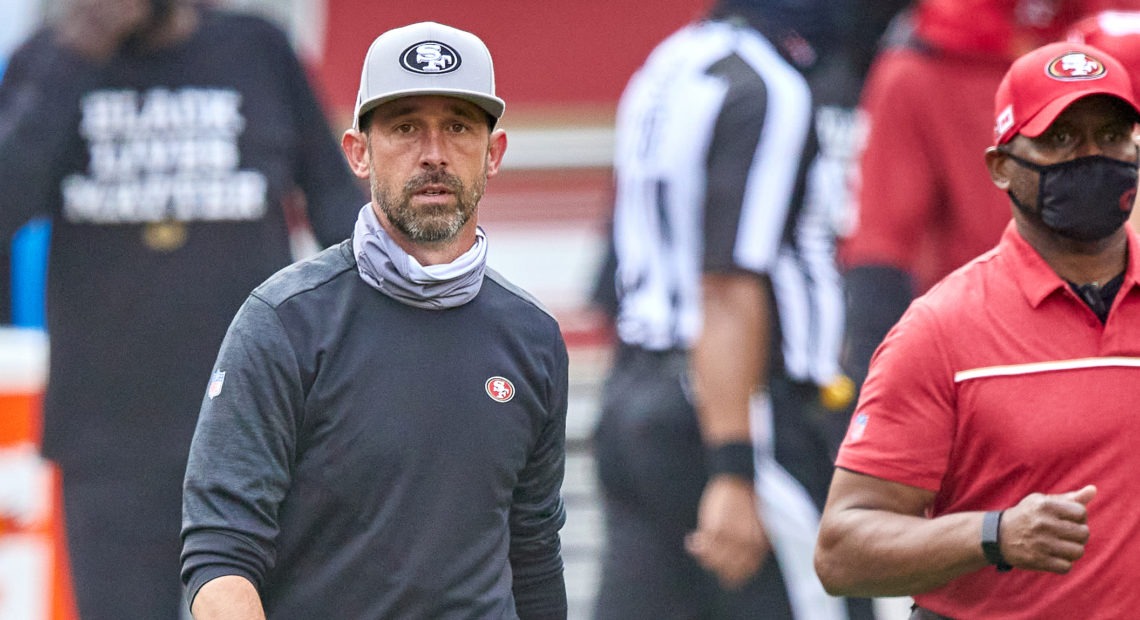 The NFL has fined San Francisco 49ers head coach Kyle Shanahan and two other coaches for not following rules about keeping their faces covered. Here, Shanahan walks off the field after his team's Sept. 13 game against the Arizona Cardinals. MSA/Icon Sportswire via Getty Images