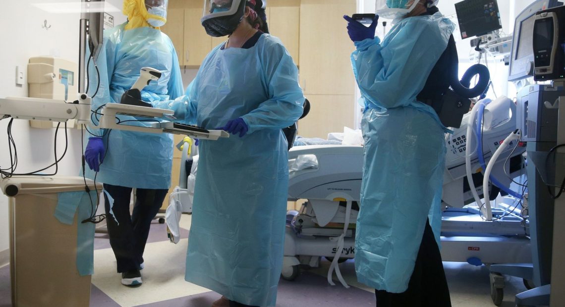 COVID-19 mortality rates are going down, according to studies of two large hospital systems, partly thanks to improvements in treatment. Here, clinicians care for a patient in July at an El Centro, Calif., hospital. CREDIT: Mario Tama/Getty Images