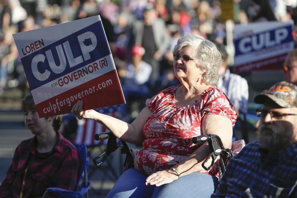 A supporter of Republican gubernatorial candidate Loren Culp attends a free rally and concert, Aug. 22, 2020. CREDIT: Jason Redmond for Crosscut