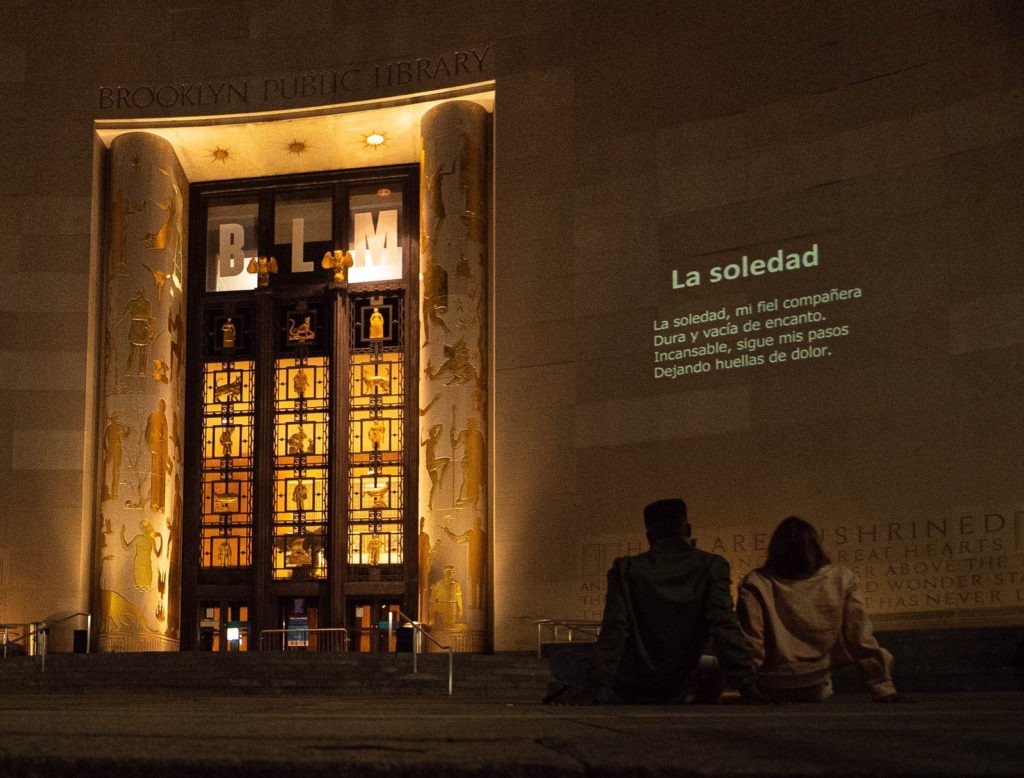 A poem projected onto the Brooklyn Public Library. CREDIT: Chemistry Creative