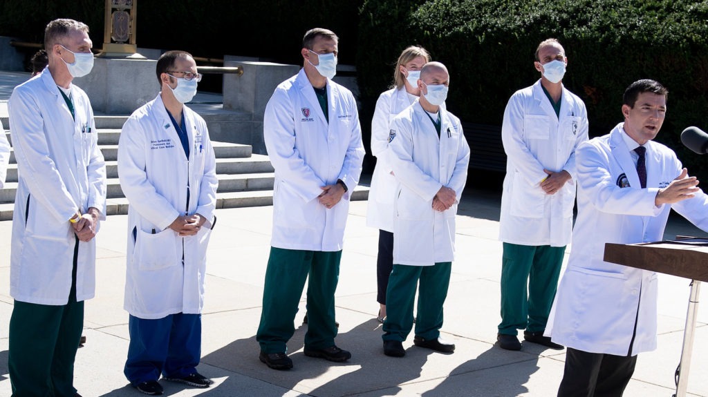 White House physician Dr. Sean Conley, with medical staff, gives an update on the condition of President Trump on Saturday at Walter Reed Medical Center in Bethesda, Md. Brendan Smialowski/AFP via Getty Images