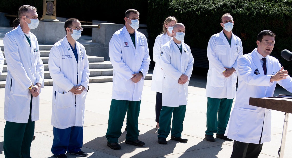 White House physician Dr. Sean Conley, with medical staff, gives an update on the condition of President Trump on Saturday at Walter Reed Medical Center in Bethesda, Md. Brendan Smialowski/AFP via Getty Images