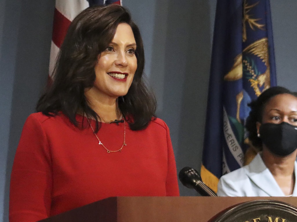 Michigan's Supreme Court ruled Friday that Democratic Gov. Gretchen Whitmer (pictured here on Sept. 16) does not have the authority to extend a state of emergency past April 30. Whitmer had cited two state laws that allowed her to maintain the state's coronavirus measures via executive order. CREDIT: AP