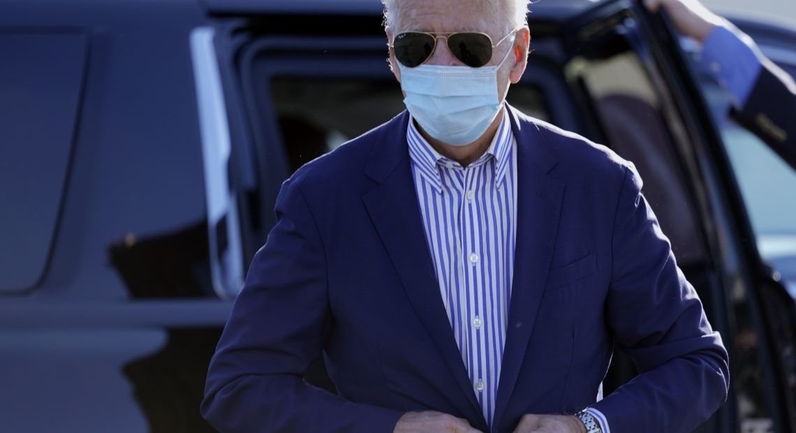 Democratic presidential candidate Joe Biden walks to board his campaign plane in New Castle, Del., earlier in October 2020. CREDIT: Carolyn Kaster/AP