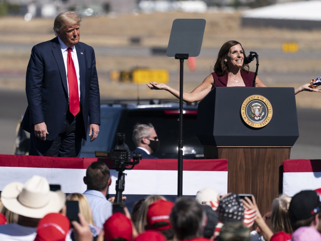 President Trump campaigned with Sen. Martha McSally, R-Ariz., in Prescott, Ariz., this month. McSally is a top target of Senate Democrats, who are hoping to flip her seat blue on Election Day. CREDIT: Alex Brandon/AP