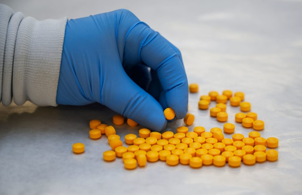 A Drug Enforcement Administration (DEA) chemist checks confiscated powder containing fentanyl at the DEA Northeast Regional Laboratory on Oct. 8, 2019 in New York. CREDIT: Don Emmert/AFP via Getty Images