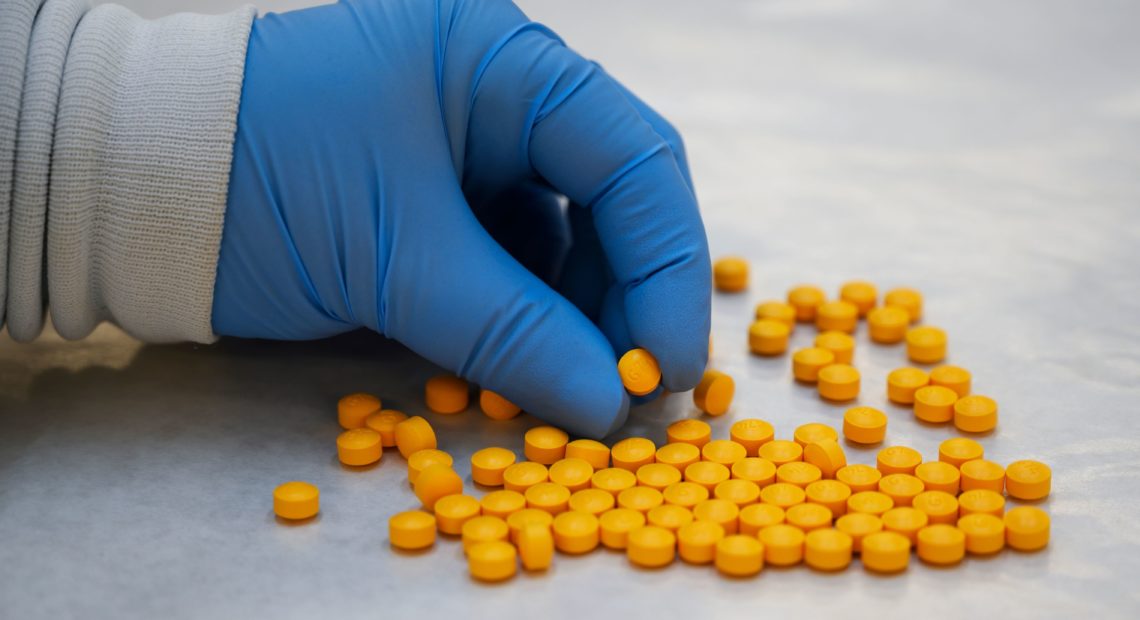 A Drug Enforcement Administration (DEA) chemist checks confiscated powder containing fentanyl at the DEA Northeast Regional Laboratory on Oct. 8, 2019 in New York. CREDIT: Don Emmert/AFP via Getty Images