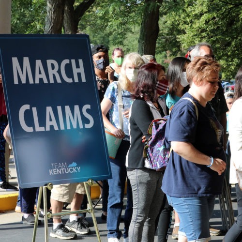 Hundreds of unemployed Kentucky residents wait in long lines outside the Kentucky Career Center in Frankfort for help with their unemployment claims on June 19. New research shows savings built up by the jobless are starting to run out. John Sommers II/Getty Images