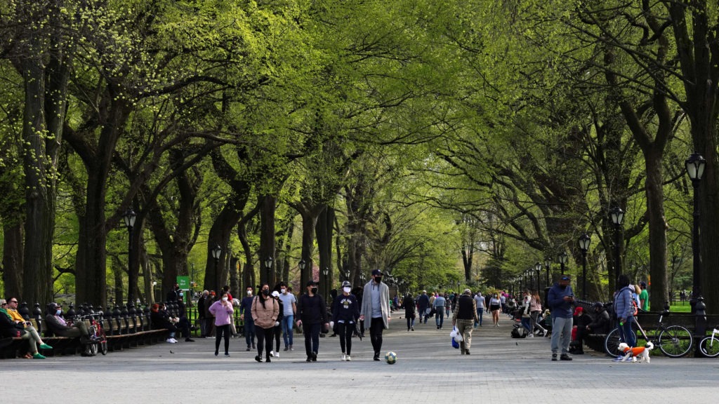 Masked pedestrians enjoy Central Park earlier this year. The New York destination now has a site-specific soundtrack courtesy of composer Ellen Reid's Soundwalk app. Cindy Ord/Getty Images