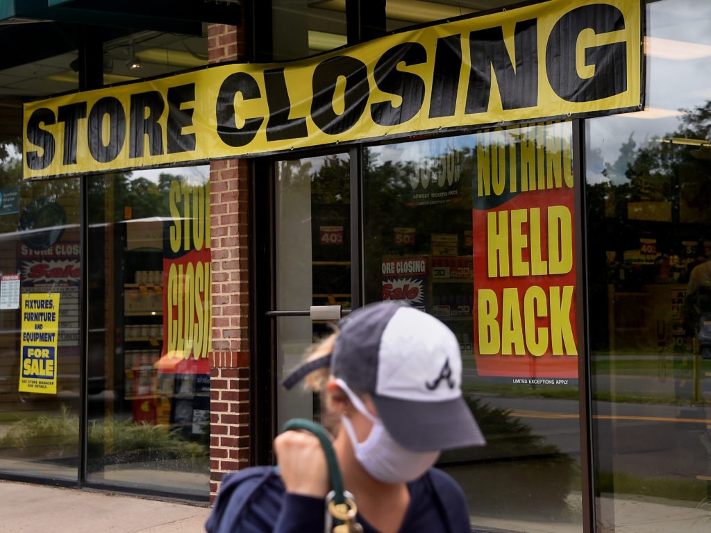 A store displays a sign before closing down permanently following the impact of the coronavirus pandemic, on Aug. 4, 2020 in Arlington, Va. The Small Business Administration's inspector general office said billions of dollars in relief loans may have been handed out to fraudsters or ineligible applicants. CREDIT: Olivier Douliery/AFP via Getty Images