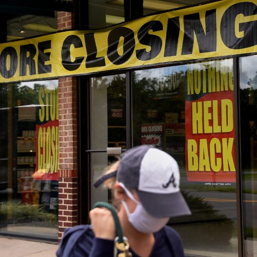 A store displays a sign before closing down permanently following the impact of the coronavirus pandemic, on Aug. 4, 2020 in Arlington, Va. The Small Business Administration's inspector general office said billions of dollars in relief loans may have been handed out to fraudsters or ineligible applicants. CREDIT: Olivier Douliery/AFP via Getty Images