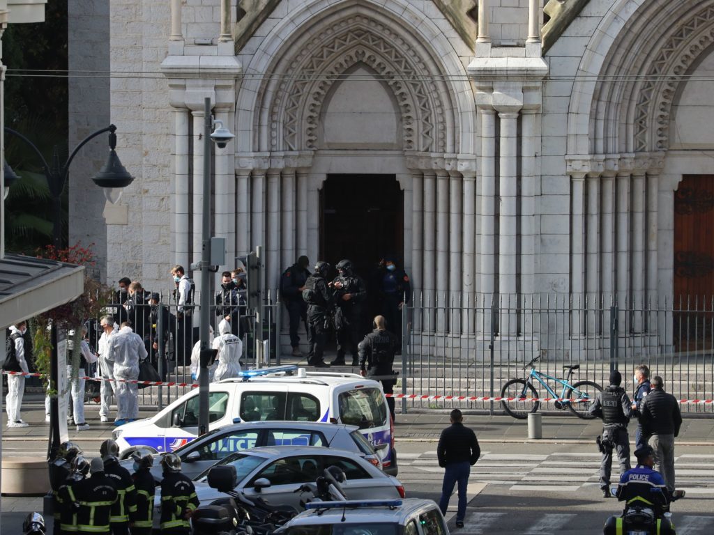 Members of a French elite tactical police unit search the Notre Dame Basilica in Nice after a knife attack that killed three people and injured several others on Thursday. CREDIT: Valery Hache/AFP via Getty Images