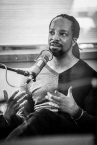 Jericho Brown talking with his hands during the recording of Traverse Talks with Sueann Ramella.