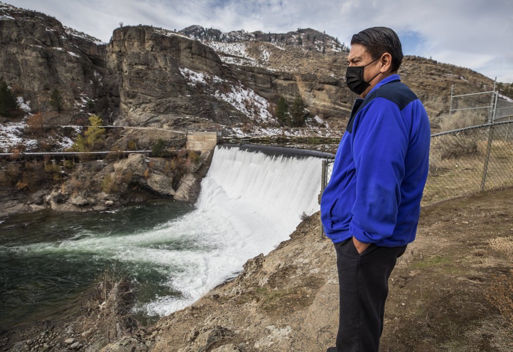 Rodney Cawston, chairmen of the Colville Tribes’ business council, stands at the site of the Enloe Dam on Oct. 28, 2020, in Oroville, Wash. Leaders of the Confederated Tribes of the Colville Reservation wants the dam, which blocks fish from reaching the Similkameen River, removed. CREDIT: Steve Ringman/The Seattle Times via AP