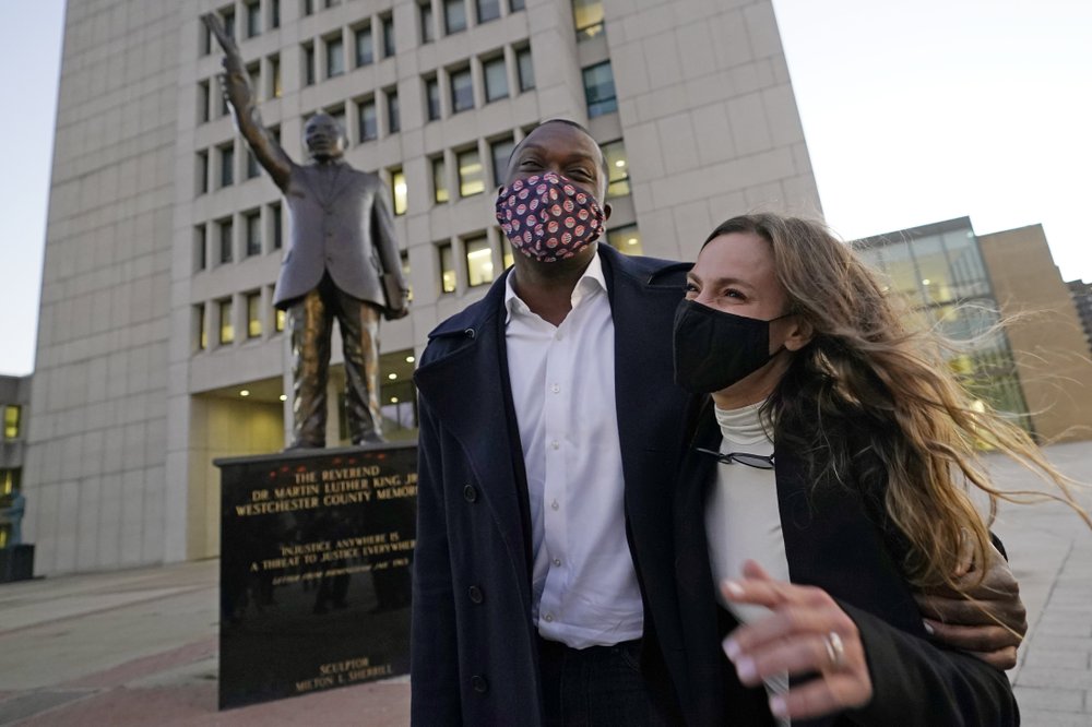 U.S. Rep.-elect Mondaire Jones, D-N.Y., celebrates with New York State Sen. Alessandra Biaggi, N.Y.-34, after speaking at a Protect the Results rally on Nov. 4, 2020. Jones and Ritchie Torres became the first openly-gay Black members of Congress. Both New Yorkers will enter Congress in January. CREDIT: Kathy Willens/AP