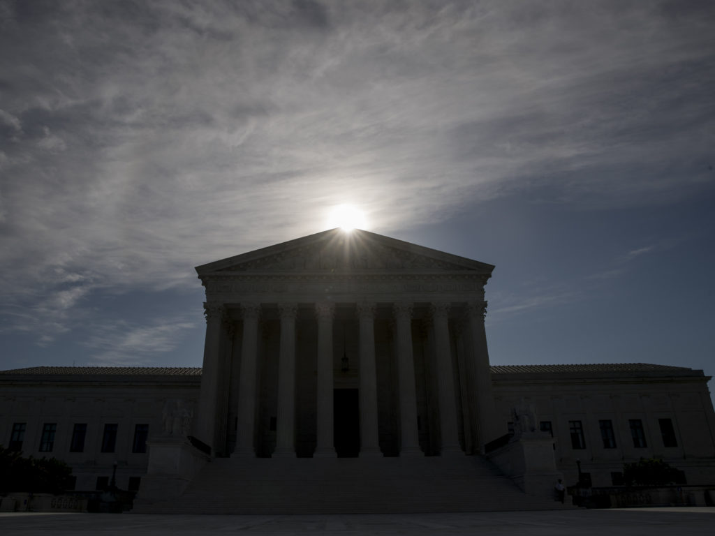 FILE - This May 4, 2020, file photo shows the Supreme Court building in Washington. Controversial Trump administration policies on the census, asylum seekers and the border wall, held illegal by lower courts, are on the Supreme Court's agenda Friday, Oct. 16, 2020. (AP Photo/Andrew Harnik