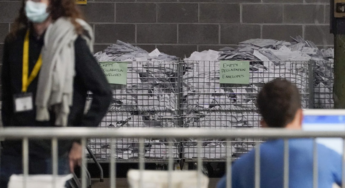 Election office workers process ballots at the Allegheny County elections returns warehouse in Pittsburgh, earlier this month. Gene J. Puskar/AP