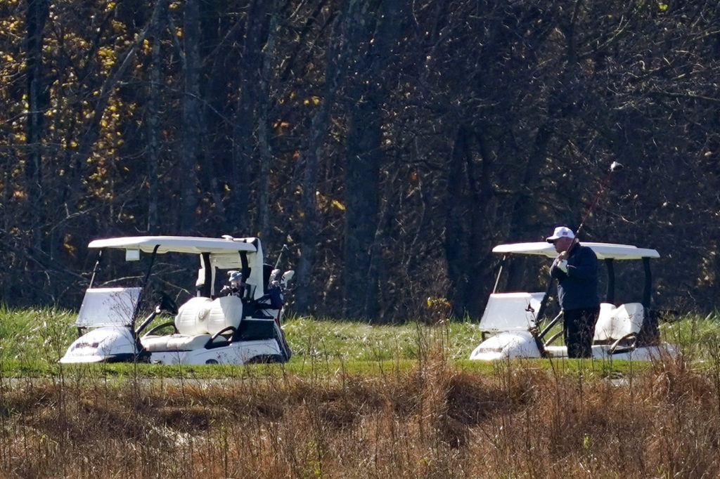 President Trump plays golf at the Trump National Golf Course on Saturday in Sterling, Va. CREDIT: Patrick Semansky/AP