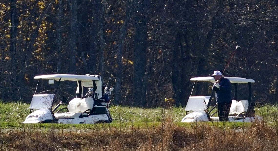 President Trump plays golf at the Trump National Golf Course on Saturday in Sterling, Va. CREDIT: Patrick Semansky/AP
