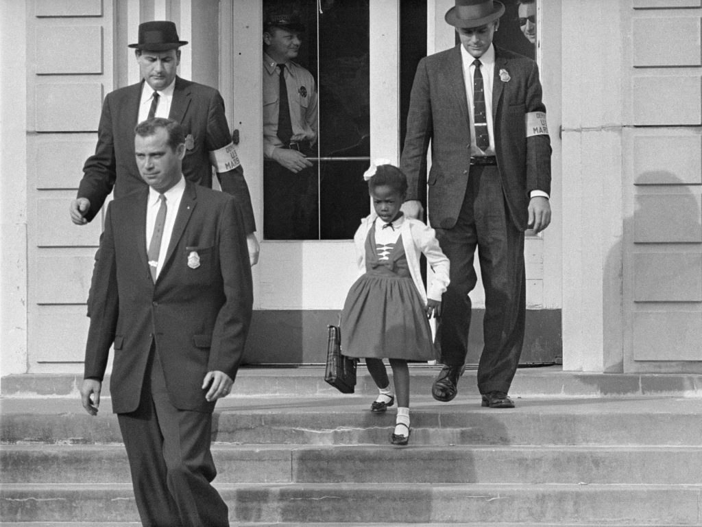 U.S. Deputy Marshals escort 6-year-old Ruby Bridges from William Frantz Elementary School in New Orleans, in this November 1960, file photo. Lucille Bridges, Ruby's mother, died Tuesday at the age of 86. Uncredited/AP