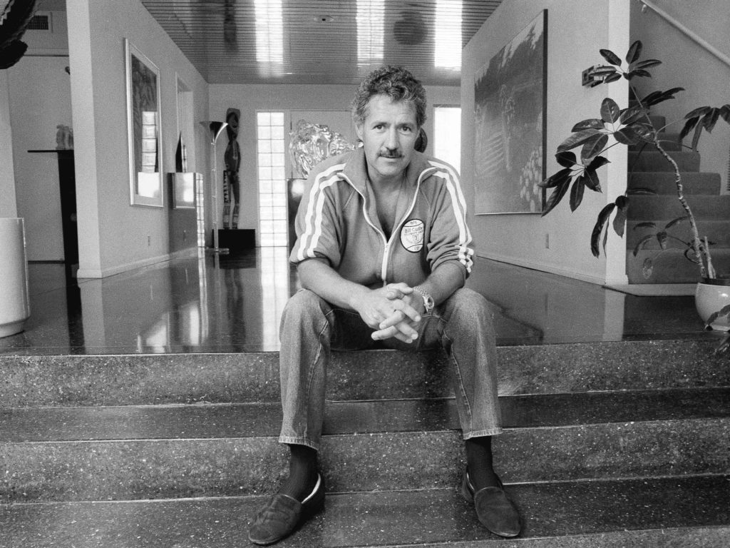 Alex Trebek began hosting Jeopardy! in 1984. He is shown above in his Los Angeles home in 1988. CREDIT: Alan Greth/AP