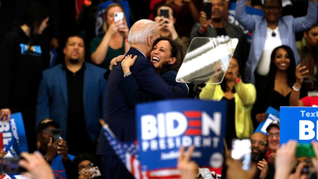 Biden hugs his former primary rival and future running mate, California Sen. Kamala Harris, after she endorsed him at a campaign rally in Detroit on March 9. CREDIT: Jeff Kowalsky/AFP via Getty Images