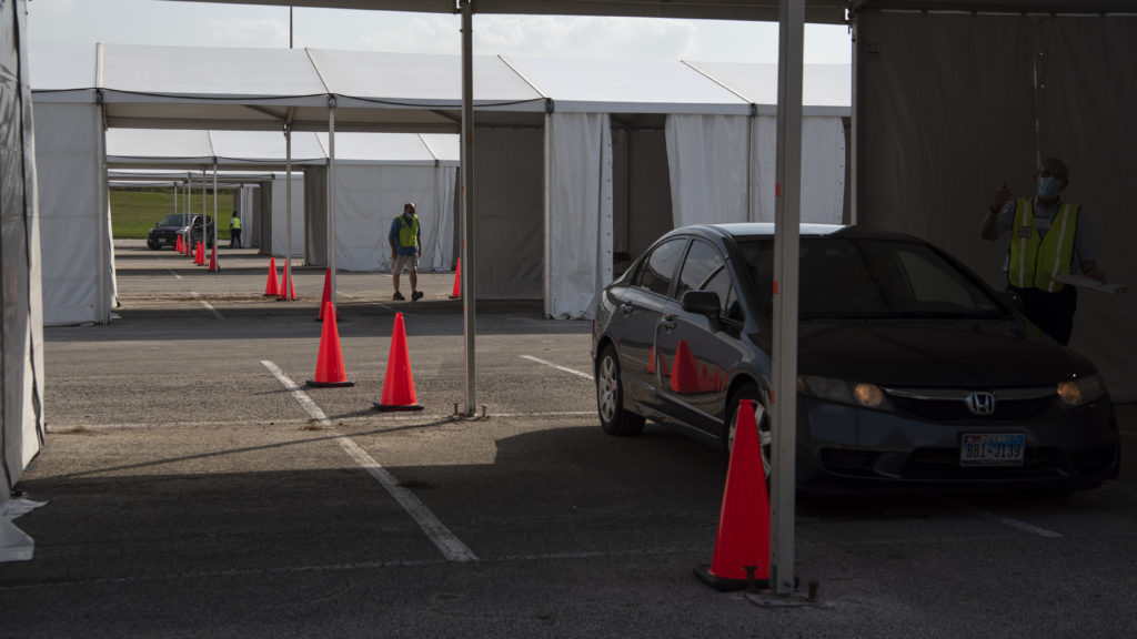 Voters drop off mail-in ballots last month at a drive-through polling place in Houston. Some 127,000 voters cast their ballots at drive-through locations in the Houston area. CREDIT: Callaghan O'Hare/Bloomberg via Getty Images