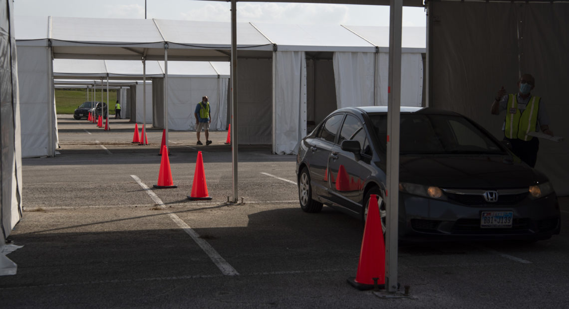 Voters drop off mail-in ballots last month at a drive-through polling place in Houston. Some 127,000 voters cast their ballots at drive-through locations in the Houston area. CREDIT: Callaghan O'Hare/Bloomberg via Getty Images