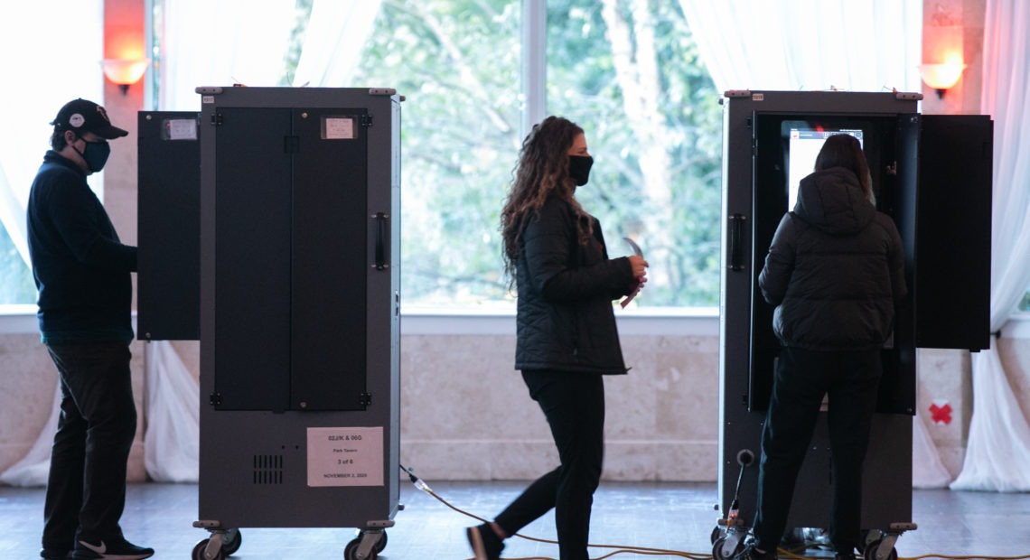 Voters cast ballots at the Park Tavern polling station on Tuesday in Atlanta. Nearly 95% of Georgia's estimated ballots have been reported, but metro Atlanta is currently the holdout area. CREDIT: Jessica McGowan/Getty Images