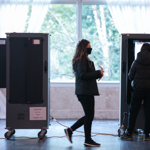 Voters cast ballots at the Park Tavern polling station on Tuesday in Atlanta. Nearly 95% of Georgia's estimated ballots have been reported, but metro Atlanta is currently the holdout area. CREDIT: Jessica McGowan/Getty Images